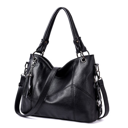 Sac à main noir femme forme seau bucket franges triple portage vintage