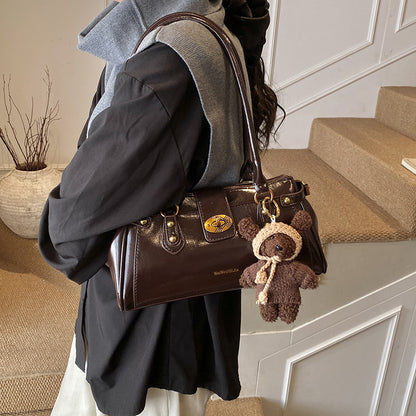 Sac commuter niche marron avec pendentif