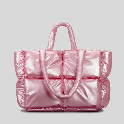 Intérieur sac matelassé vert ouvert, doublure nylon, poche zippée et poche téléphone visibles
