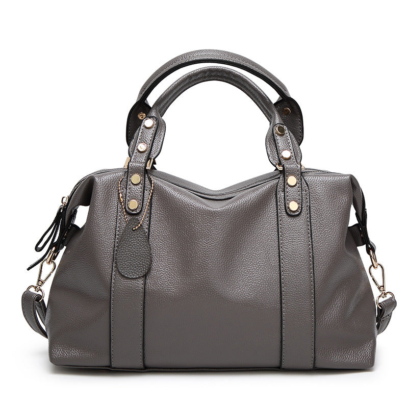 Sac boston rivets noir crossbody