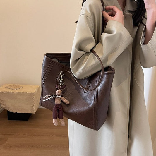 Sac unisexe cuir PU minimaliste avec pendentif style neutre pour homme et femme