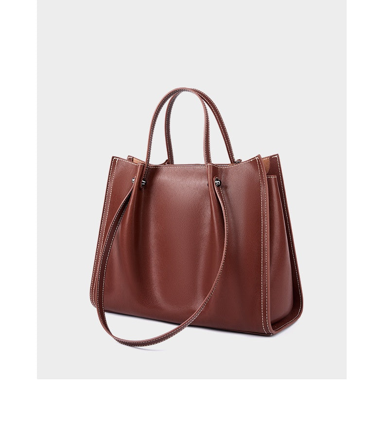 Intérieur sac ordinateur femme cuir ouvert, poche zippée, porte-documents et compartiment sandwich visibles

